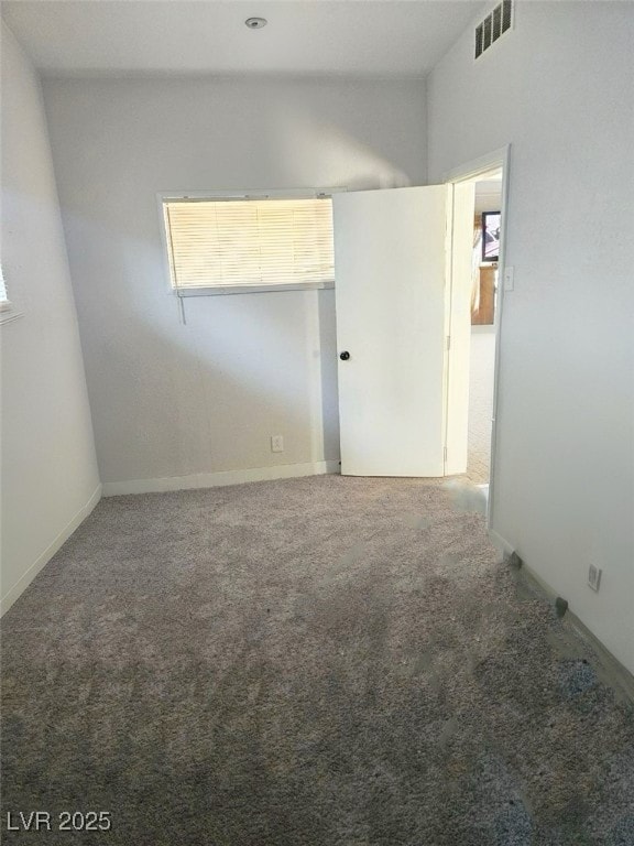 empty room featuring carpet floors