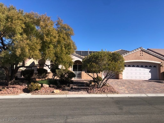 obstructed view of property with a garage