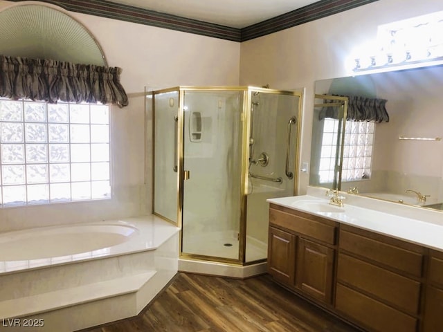 bathroom with separate shower and tub, vanity, and wood-type flooring