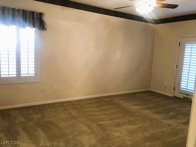 carpeted empty room featuring ceiling fan and crown molding