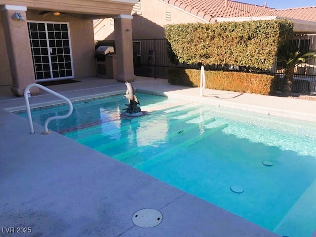 view of pool with area for grilling