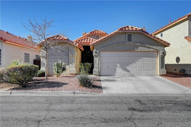 mediterranean / spanish-style home featuring a garage