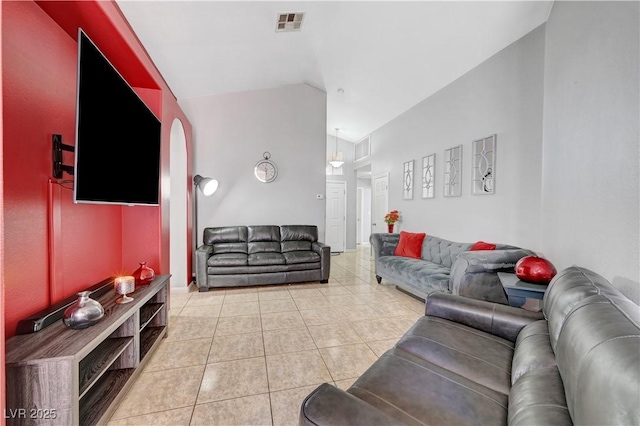 living room featuring tile patterned floors and lofted ceiling