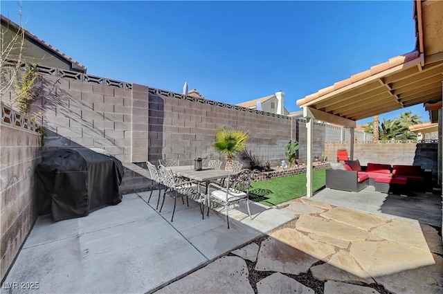 view of patio featuring an outdoor hangout area and a grill