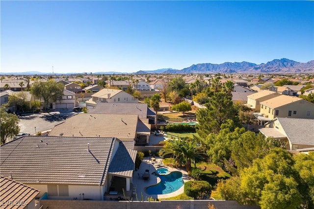 birds eye view of property with a mountain view