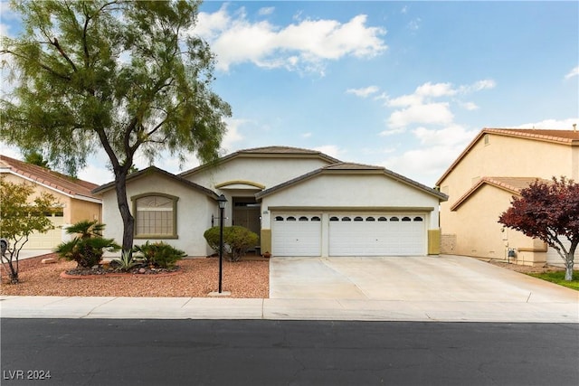 view of front of home with a garage