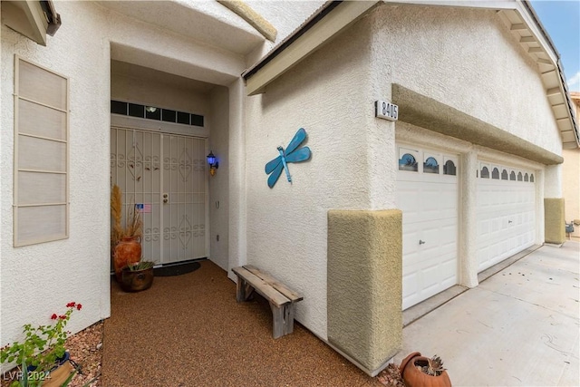 entrance to property featuring a garage