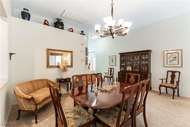 carpeted dining space featuring a chandelier