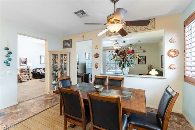 dining space featuring ceiling fan