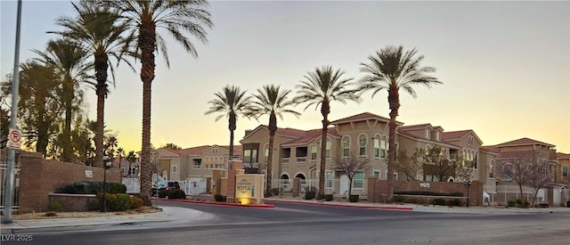 view of outdoor building at dusk