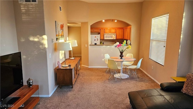 view of carpeted dining space