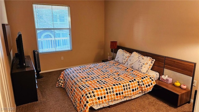 bedroom with dark carpet