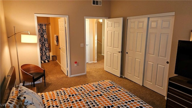 bedroom with carpet and a closet