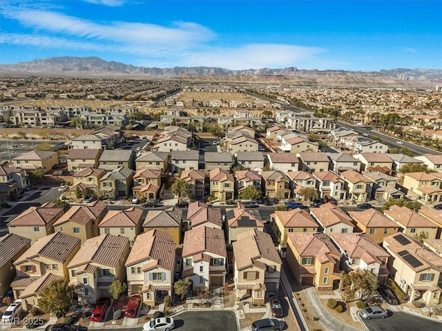 birds eye view of property with a mountain view