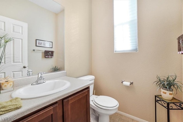 bathroom with tile patterned floors, vanity, and toilet