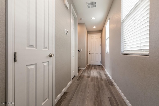 hallway featuring dark hardwood / wood-style floors