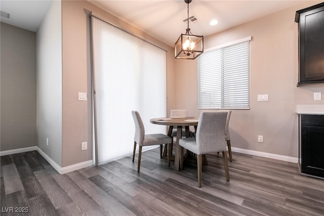 dining area featuring dark hardwood / wood-style floors