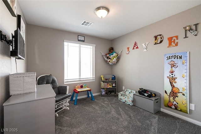 recreation room with dark carpet