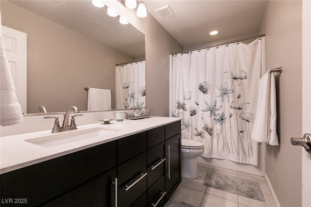 bathroom featuring vanity, toilet, and tile patterned flooring