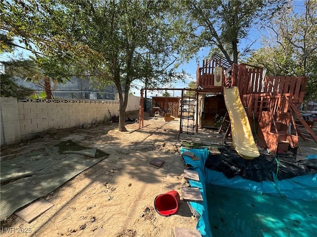 2127 Crawford St, North Las Vegas, NV 89030 - view of play area with a fenced backyard