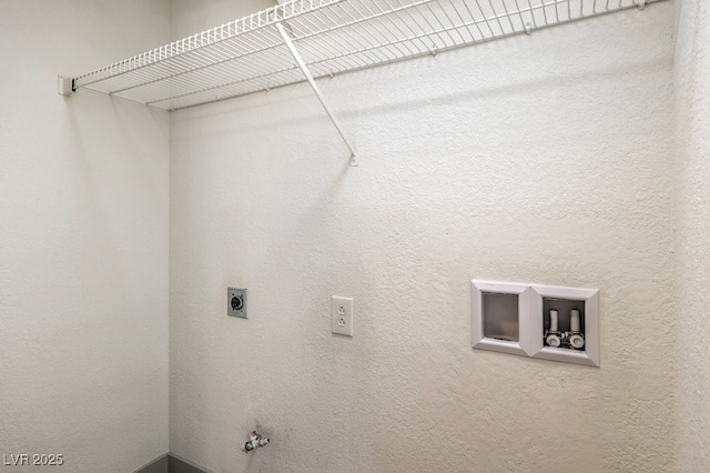 clothes washing area with washer hookup, gas dryer hookup, and hookup for an electric dryer