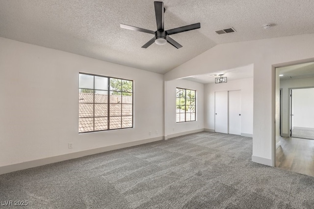 interior space with ceiling fan, light colored carpet, a closet, and lofted ceiling