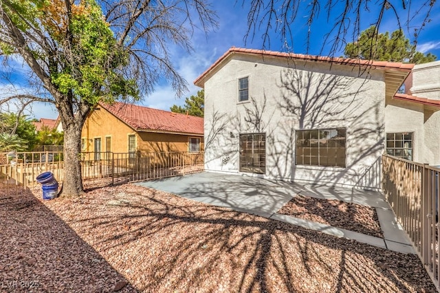 back of house with a patio area