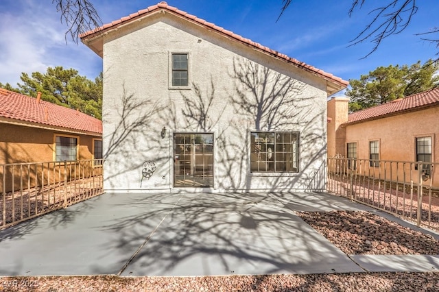 back of property featuring a patio area