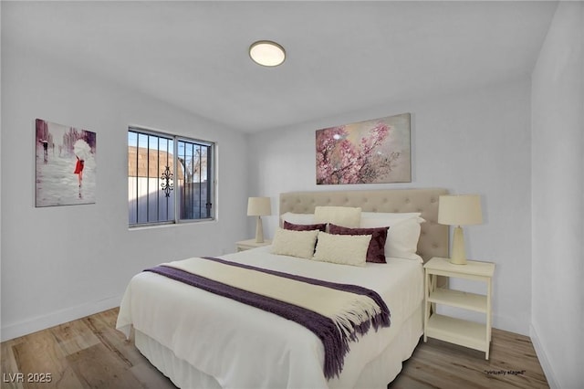 bedroom with hardwood / wood-style flooring