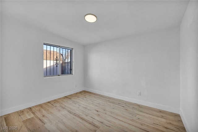 unfurnished room with light hardwood / wood-style floors