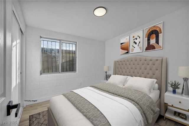 bedroom featuring hardwood / wood-style flooring