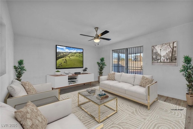 living room with ceiling fan and hardwood / wood-style floors