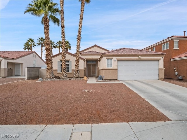 view of front of property featuring a tiled roof, an attached garage, driveway, and stucco siding