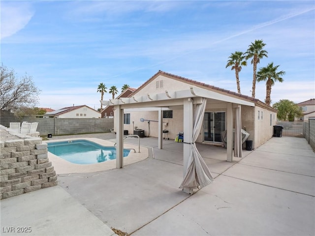 view of swimming pool featuring a patio, a fenced backyard, and a fenced in pool