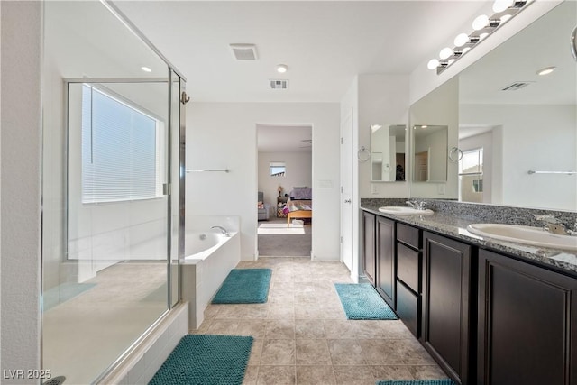 bathroom with vanity, independent shower and bath, and tile patterned floors