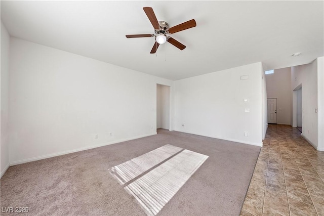 carpeted empty room with ceiling fan