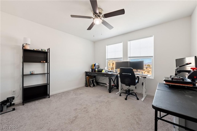 carpeted home office with ceiling fan