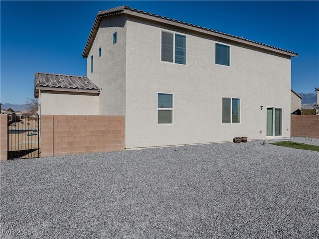 rear view of property featuring a patio area