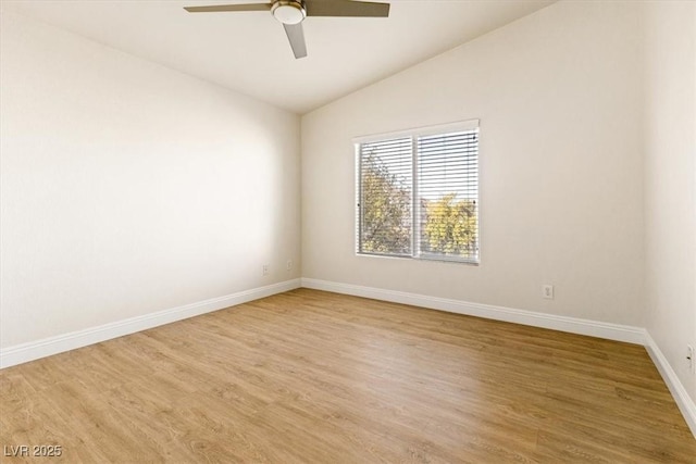 unfurnished room with ceiling fan, vaulted ceiling, and hardwood / wood-style flooring