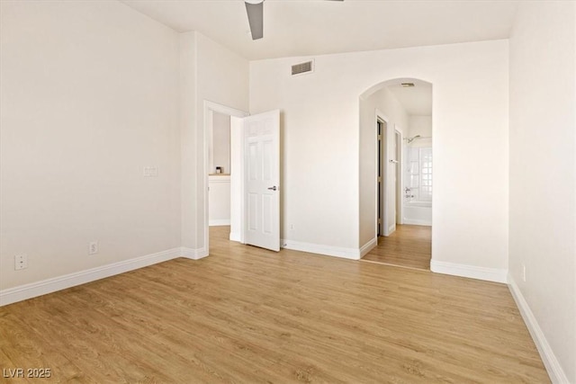 spare room featuring ceiling fan and light hardwood / wood-style flooring