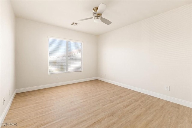 unfurnished room with ceiling fan and light hardwood / wood-style flooring