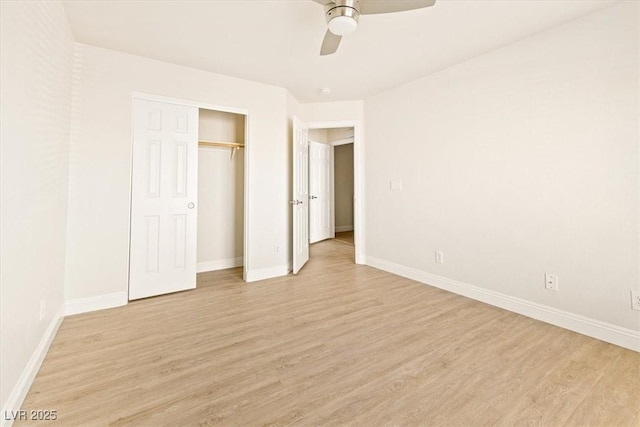 unfurnished bedroom with ceiling fan, a closet, and light hardwood / wood-style floors