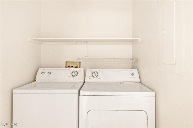 clothes washing area with washing machine and clothes dryer