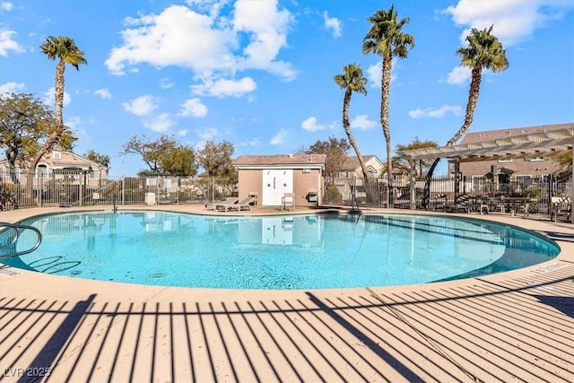 view of swimming pool featuring a patio and a pergola