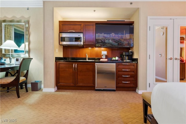 interior space with sink and refrigerator