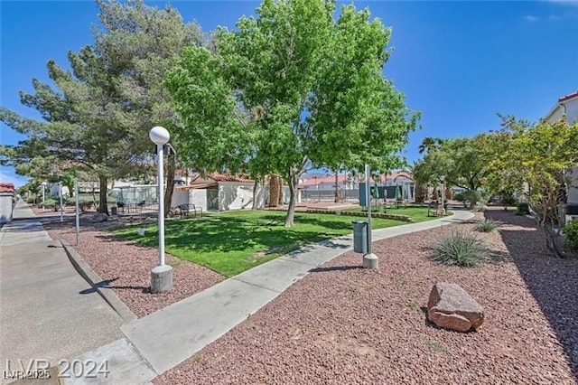 view of home's community featuring a yard