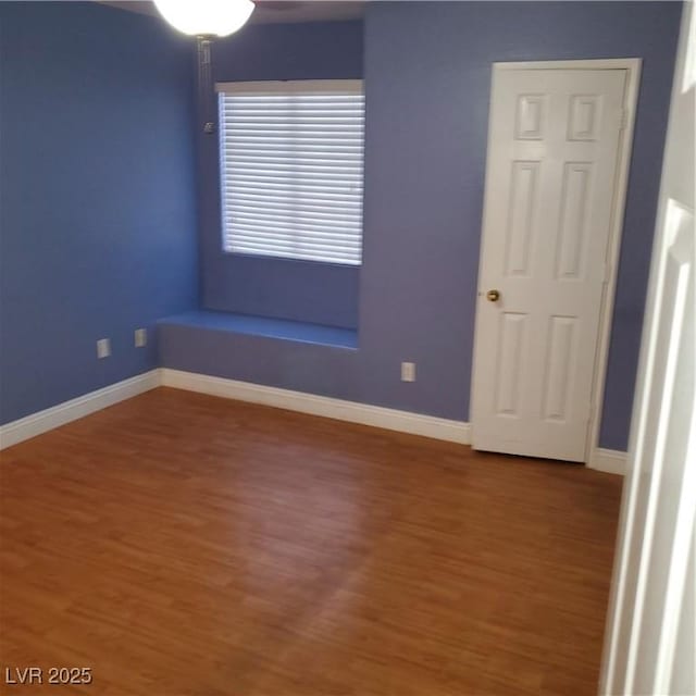 empty room featuring hardwood / wood-style flooring