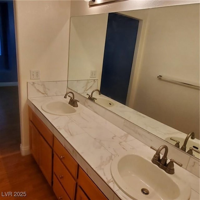 bathroom with vanity and hardwood / wood-style flooring