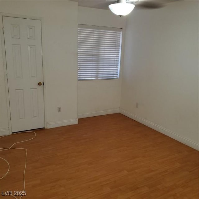 empty room with hardwood / wood-style floors