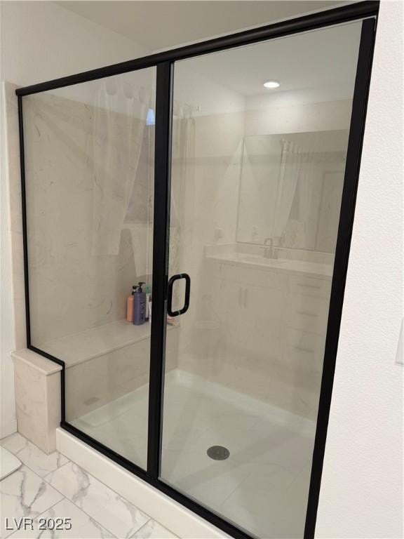 bathroom featuring an enclosed shower